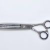 Professional hair thinning scissors on white background.