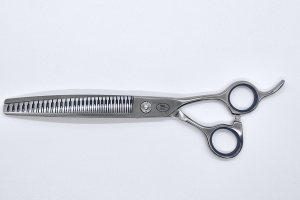 Professional hair thinning scissors on white background.