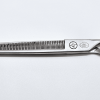 Professional hair thinning scissors on white background.