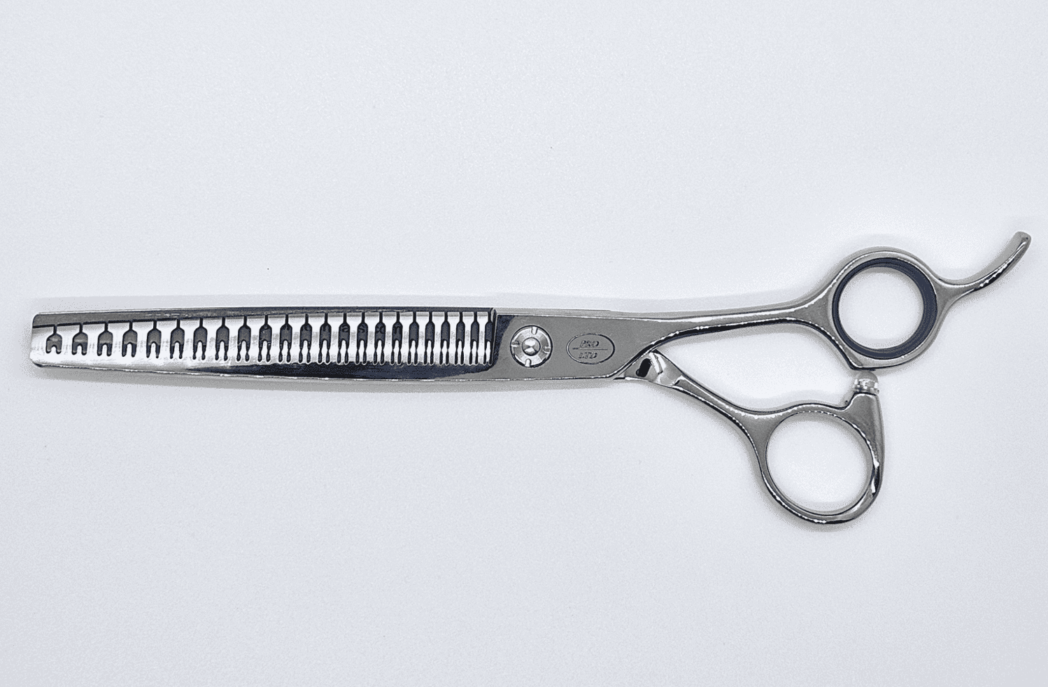 Professional hair thinning scissors on white background.