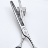 Professional hair thinning scissors on block