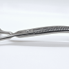 Professional hair thinning scissors on wooden block