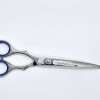 Silver hairdressing scissors on white background.