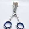 Hairdressing scissors on white background.