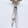 Silver scissors with blue handles on white background.