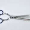 Professional hair thinning scissors on white background.