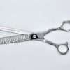 Silver hair thinning shears on white background