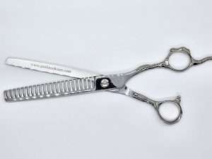 Silver hair thinning shears on white background