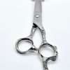 Vintage barber scissors with intricate handles.