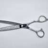 Silver hair thinning scissors on white background