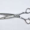 Professional hair cutting scissors on white background