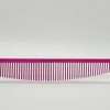 Pink hair comb on white background.
