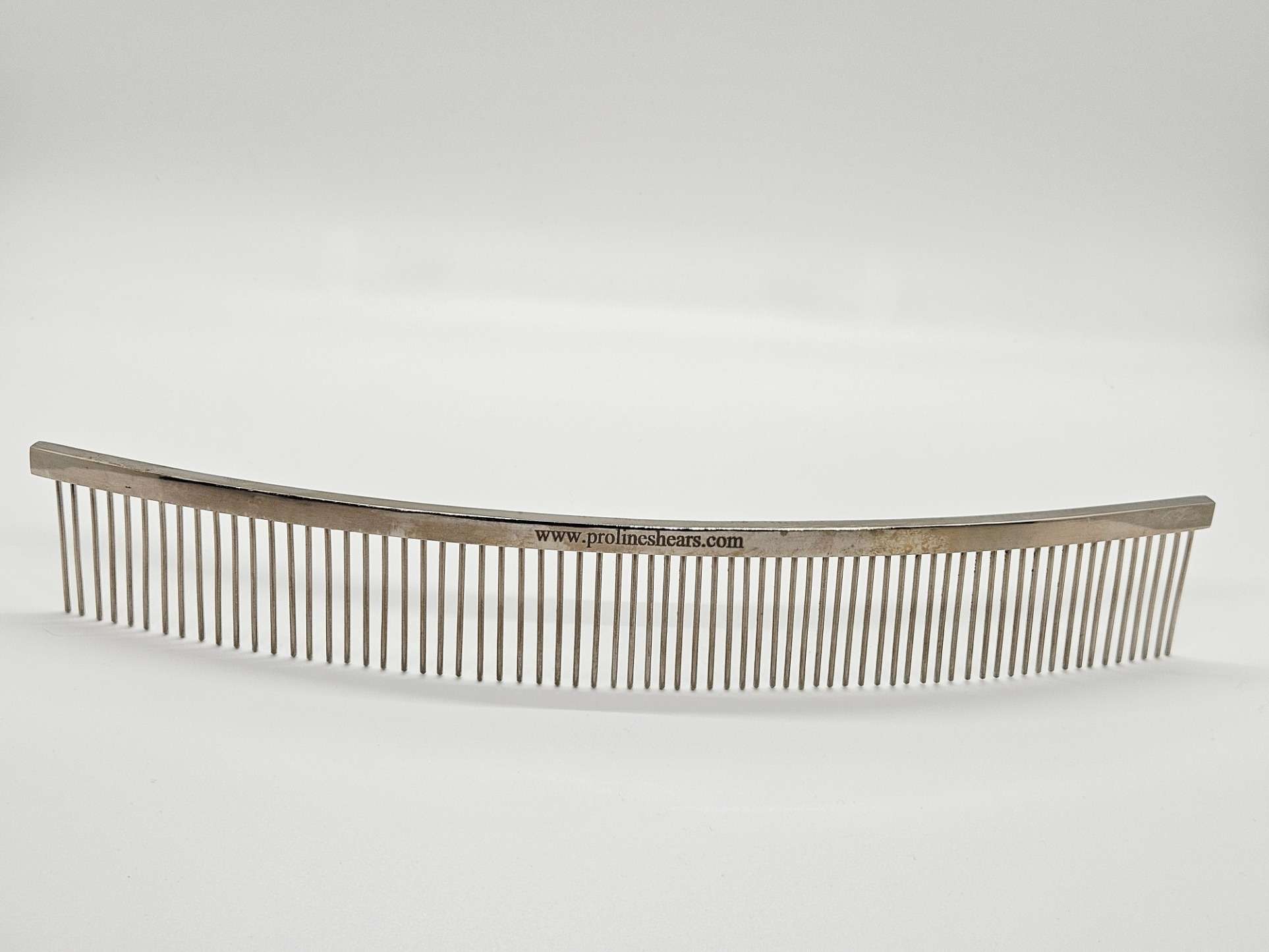 Metal grooming comb for pets or barbers