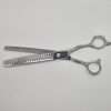 Silver hair thinning scissors on white background