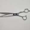 Professional hair cutting scissors on white background.