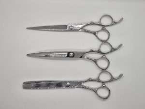 Three types of professional haircutting scissors