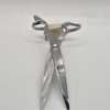 Silver hair scissors on wooden block
