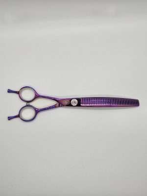 Purple hair thinning scissors on white background.