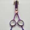 Colorful hair trimming scissors on display