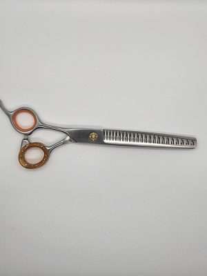Professional hair thinning scissors on white background.