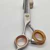 Professional hair thinning scissors with orange grips